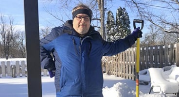 Picture of north dakota man with shovel.